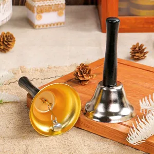 Set of golden and silver Christmas hand bells with ergonomic black wooden handles