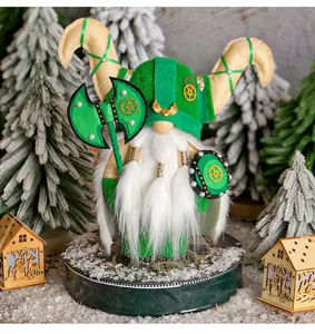 Close-up of Viking gnome doll featuring a green felt hat, white beard, and gold gear details