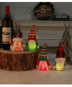Cute glowing Christmas gnomes with LED lights, festive hats, and reindeer antlers.