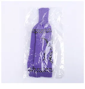 Purple knitted Halloween wine bottle cover with bat pattern in plastic packaging.