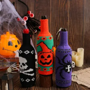 Knitted Halloween wine bottle covers featuring skull, pumpkin, and spider designs