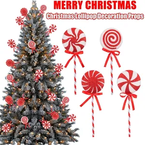 Glittery red and white oversized Christmas lollipop ornaments for festive tree decoration