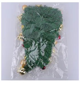 Christmas teardrop swag with gold and red ornaments in clear plastic packaging