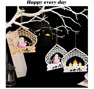 Wooden Ramadan ornaments featuring castle and girl designs on decorative branches.