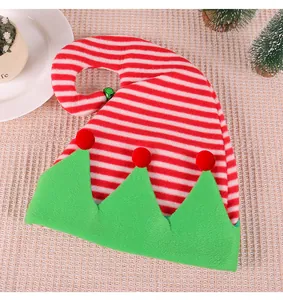 Detail view of a festive red and white striped Christmas elf hat with green trim and bell.