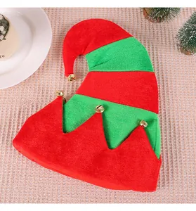 Detail view of a red and green striped Christmas elf hat decorated with gold bells.