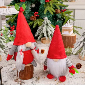 Pair of festive Christmas gnomes with red cherry accents in a snowy winter scene