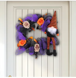 Detailed view of Halloween gnome wreath with purple mesh and orange roses on door