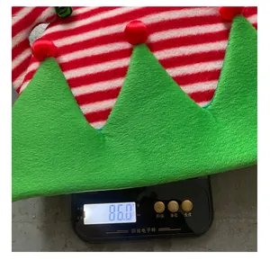 Detailed view showing the weight of the striped Christmas elf hat as 86.0 grams