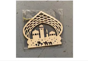 Detailed close-up view of a laser-cut wooden mosque ornament in protective clear packaging
