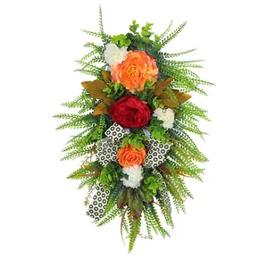 Artificial autumn door swag with peony flowers and green foliage