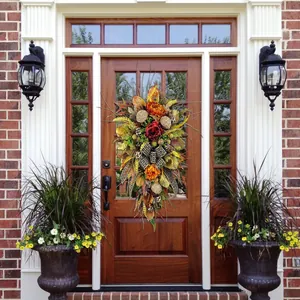 Autumn harvest door swag with leopard print ribbon on a classic wooden front door