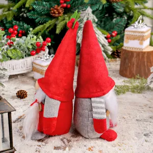Pair of festive Christmas gnome plush dolls for holiday home and window display decor