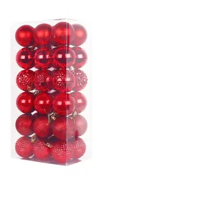 Set of 24 assorted red Christmas ball ornaments with mixed textures in a clear storage box