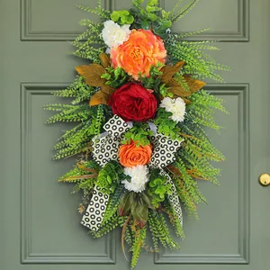 Autumn harvest door swag with vibrant orange peonies and leopard print ribbon decoration