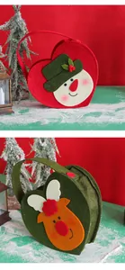 Detail views of festive heart-shaped Christmas felt bags with snowman and reindeer designs
