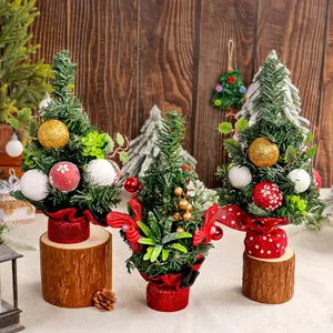 Mini Christmas tree ornaments with pine needles red berries and rustic wooden bases