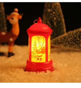 Detailed view of a glowing red Christmas lantern with Santa Claus on a snowy background.