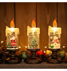 Three festive Christmas LED candle snow globe lights with snowman, tree and Santa.