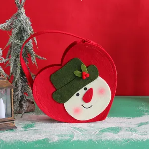 Red heart-shaped Christmas felt gift bag featuring a cute snowman design with hand strap