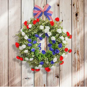 Close-up of a patriotic Independence Day wreath with red white blue flowers and bow
