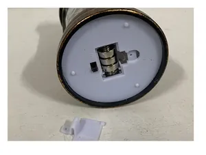 Detail view of Christmas lantern base showing battery compartment and on-off switch.