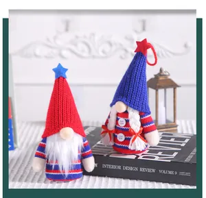Two handmade patriotic gnome dolls with knitted hats for 4th of July holiday decoration