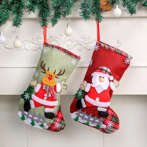 Burlap Christmas stockings with Santa and reindeer appliques for festive decor