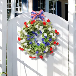Patriotic American Independence Day wreath decorated with red, white and blue flowers