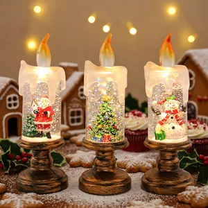 Set of 3 Christmas snow globe LED candles with Santa, tree, and snowman figures.