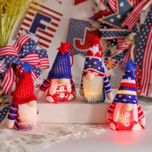 Four glowing Fourth of July patriotic gnome ornaments with knit hats and stars