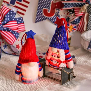 Two LED Independence Day gnomes featuring patriotic red blue knitted hats and stars