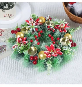 Top view of decorative Christmas wreath candle holder with red berries and pine needles