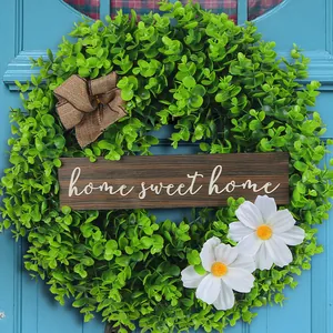Artificial eucalyptus wreath with Home Sweet Home sign for front door decor