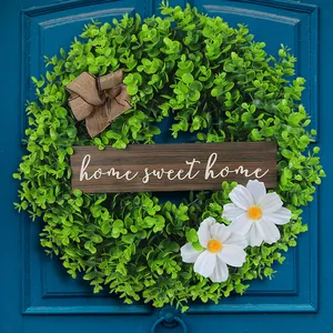 Artificial green boxwood wreath with wooden Home Sweet Home sign for front door decor
