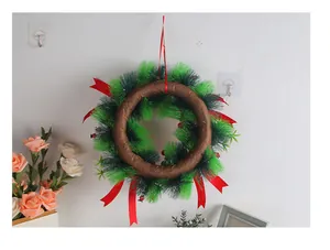 Detailed back view of an artificial Christmas wreath with pine needles and berries