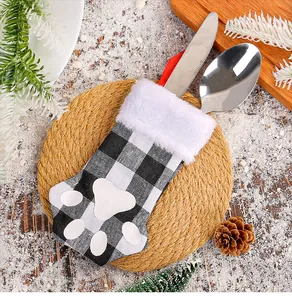 Detail of Christmas cat paw cutlery holder in buffalo plaid with white fur trim