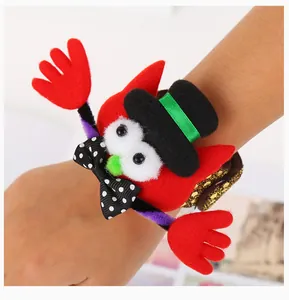 Close-up detail of a red plush Halloween character slap bracelet shown on an arm for party