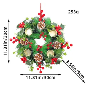 Christmas wreath candle holder featuring pine needles red berries and cones 30cm size