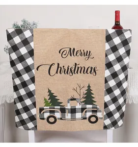 Detail of rustic burlap Christmas chair cover featuring buffalo check and truck design