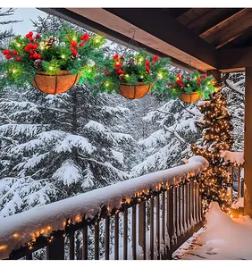 Artificial Christmas hanging baskets with lights on a snowy balcony decor.