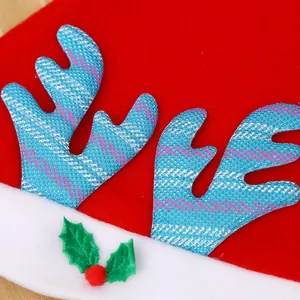 Macro detail of a festive kids' Christmas hat featuring blue glittery reindeer antlers.