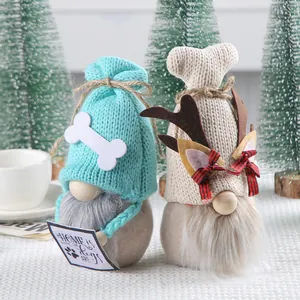 Set of two festive knitted gnomes with dog-themed and reindeer designs for Christmas decor