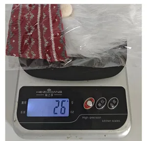 Macro detail of a digital kitchen scale measuring 26g for a Christmas gnome cover