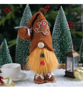 Detail view of a cozy brown Christmas gnome with a gingerbread man hat