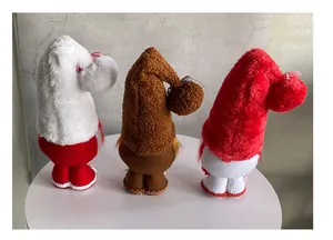 Detailed back view of three plush Christmas gnomes in red, white, and brown festive colors