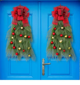 Festive Christmas green mesh door wreaths with red plaid bows and colorful baubles