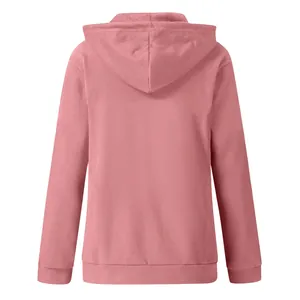Back view of a women's solid pink long sleeve zip-up hooded sweatshirt with ribbed hem