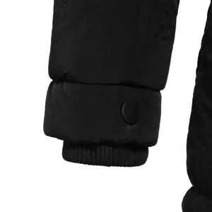 Detailed macro view of black winter puffer jacket ribbed windproof cuffs and button
