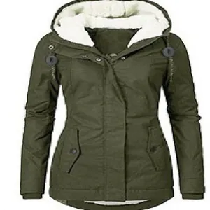Women's warm dark green winter parka with a cozy white fleece lined hood for outdoors
